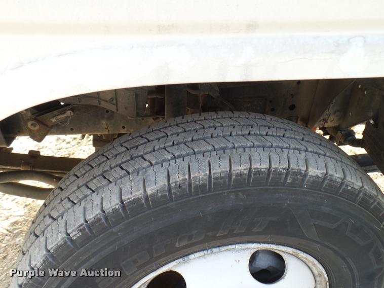 image for item DB2463 2004 Isuzu NPR flatbed truck