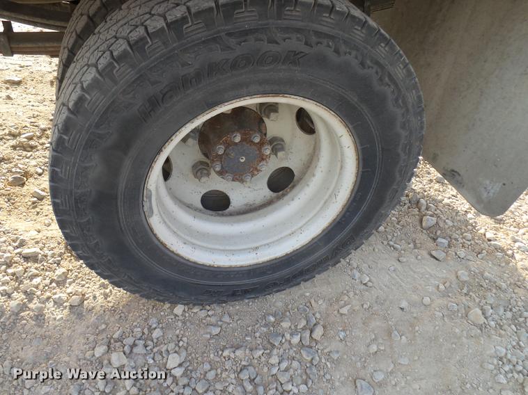 image for item DB2463 2004 Isuzu NPR flatbed truck