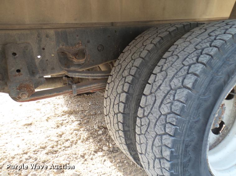 image for item DB2463 2004 Isuzu NPR flatbed truck