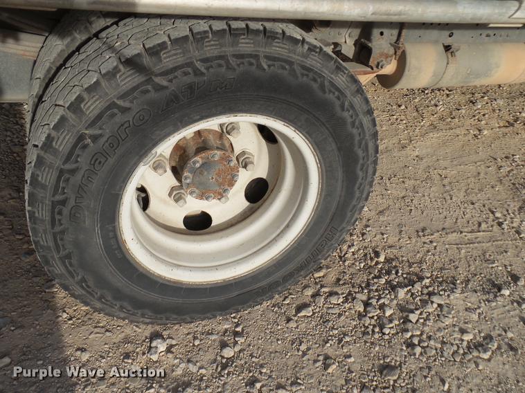 image for item DB2463 2004 Isuzu NPR flatbed truck