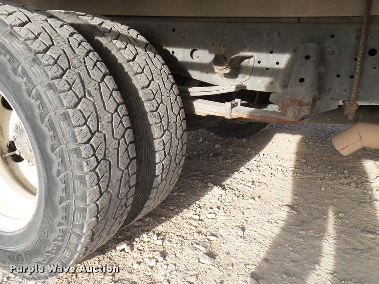 image for item DB2463 2004 Isuzu NPR flatbed truck