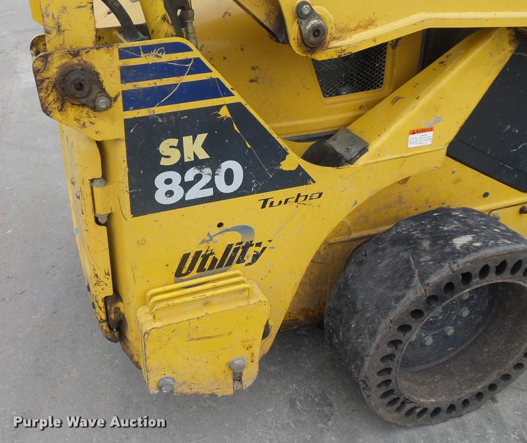 image for item J1567 2006 Komatsu SK820 skid steer