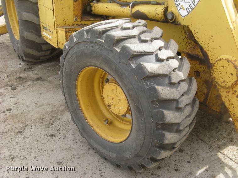 image for item L3987 1995 John Deere 710D backhoe