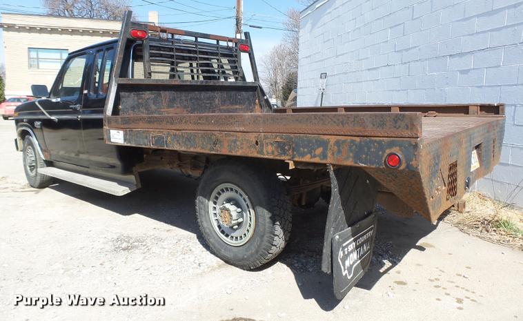 image for item DA0602 1985 Ford F250 XLT Lariat Ext. Cab flatbed pickup truck
