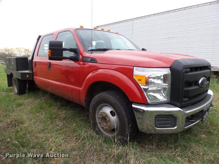image for item DA0651 2012 Ford F350 Super Duty XL Crew Cab flatbed pickup truck