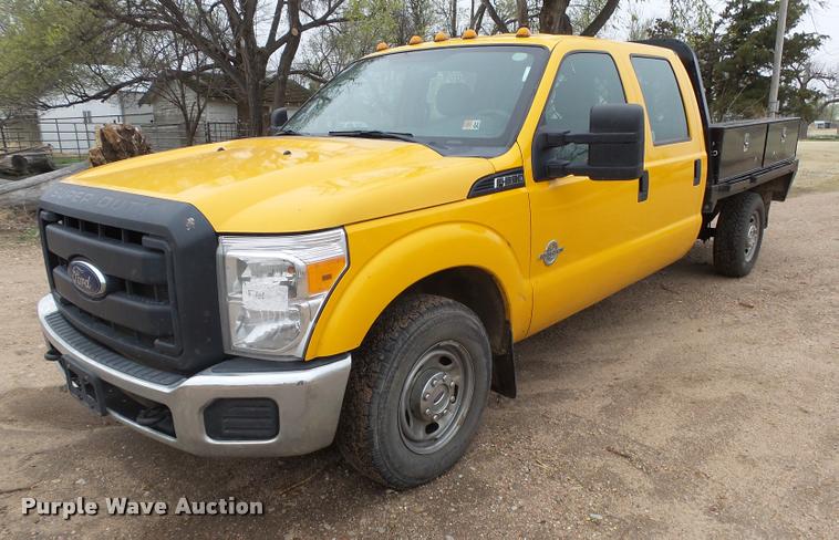 image for item DB1998 2012 Ford F350 Super Duty Crew Cab flatbed pickup truck