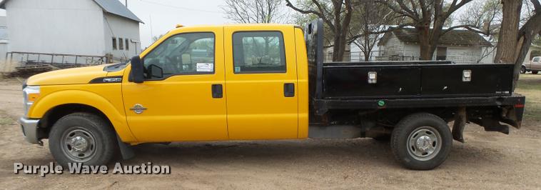 image for item DB1998 2012 Ford F350 Super Duty Crew Cab flatbed pickup truck