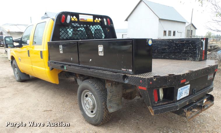 image for item DB1998 2012 Ford F350 Super Duty Crew Cab flatbed pickup truck
