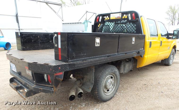 image for item DB1998 2012 Ford F350 Super Duty Crew Cab flatbed pickup truck