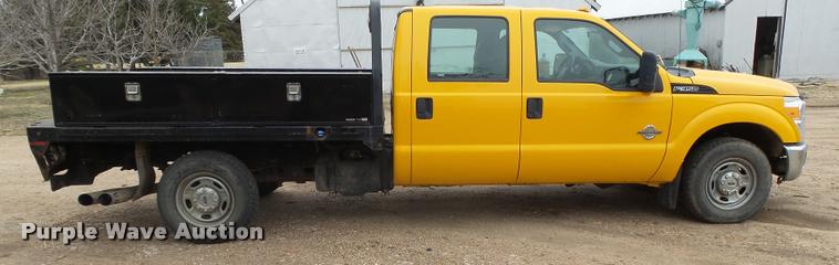image for item DB1998 2012 Ford F350 Super Duty Crew Cab flatbed pickup truck