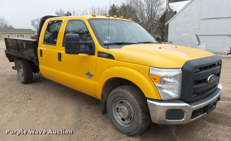 image for item DB1998 2012 Ford F350 Super Duty Crew Cab flatbed pickup truck