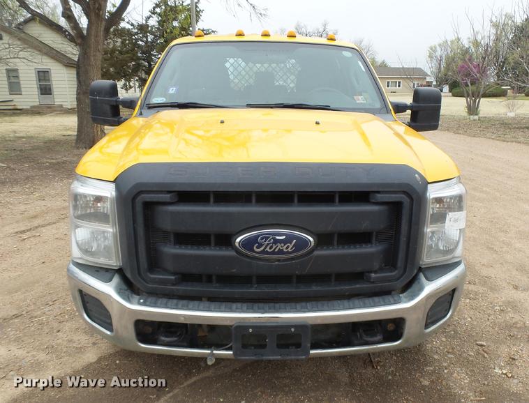 image for item DB1998 2012 Ford F350 Super Duty Crew Cab flatbed pickup truck