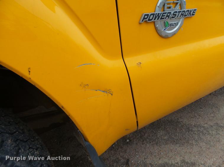 image for item DB1998 2012 Ford F350 Super Duty Crew Cab flatbed pickup truck