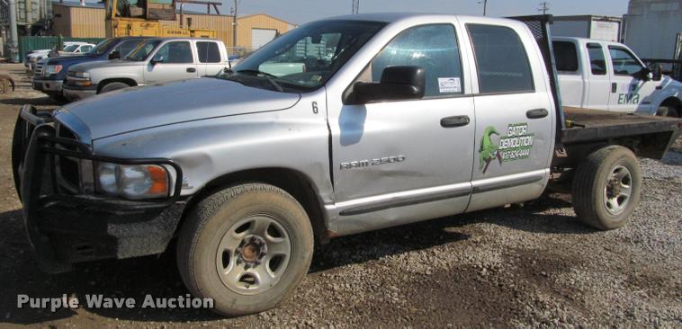 image for item J2597 2005 Dodge Ram 2500 Quad Cab flatbed pickup truck