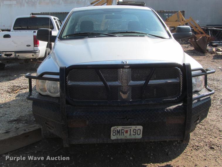 image for item J2597 2005 Dodge Ram 2500 Quad Cab flatbed pickup truck