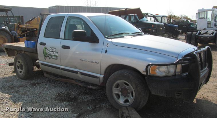 image for item J2597 2005 Dodge Ram 2500 Quad Cab flatbed pickup truck