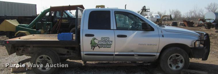 image for item J2597 2005 Dodge Ram 2500 Quad Cab flatbed pickup truck