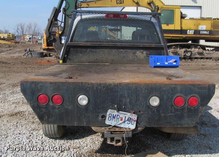 image for item J2597 2005 Dodge Ram 2500 Quad Cab flatbed pickup truck