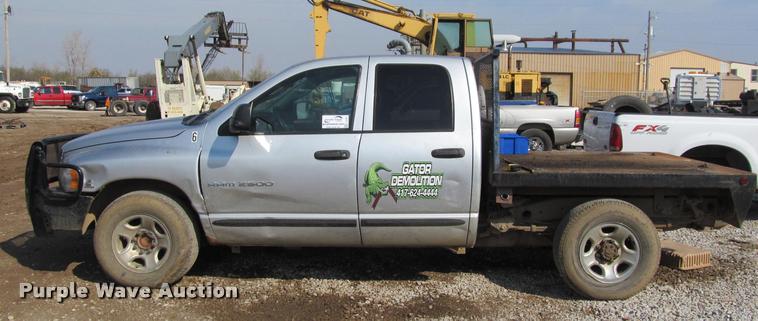 image for item J2597 2005 Dodge Ram 2500 Quad Cab flatbed pickup truck