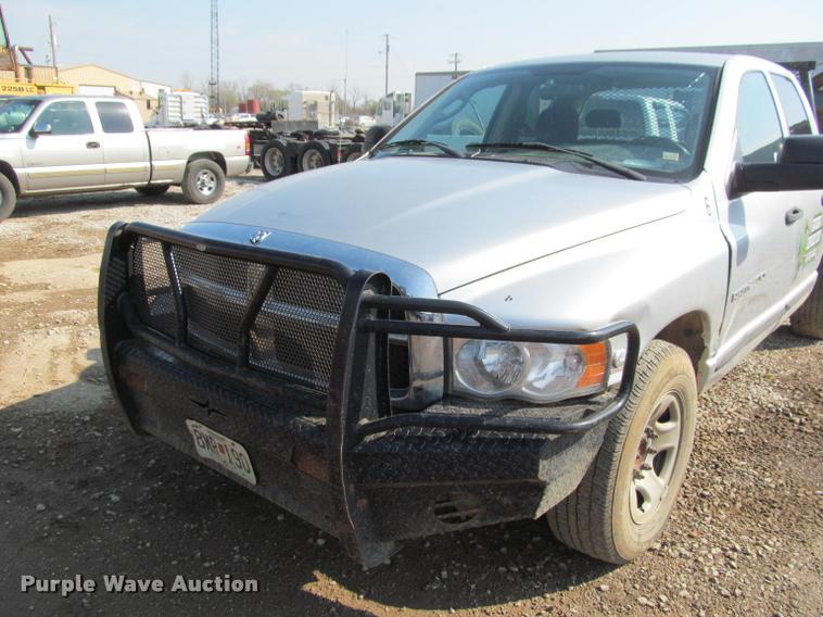 image for item J2597 2005 Dodge Ram 2500 Quad Cab flatbed pickup truck