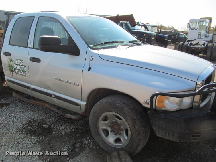 image for item J2597 2005 Dodge Ram 2500 Quad Cab flatbed pickup truck