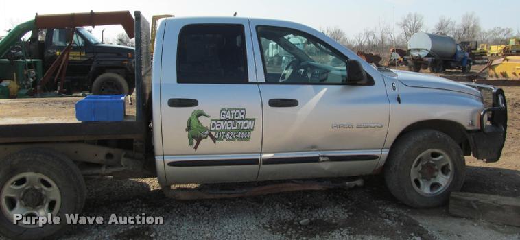 image for item J2597 2005 Dodge Ram 2500 Quad Cab flatbed pickup truck