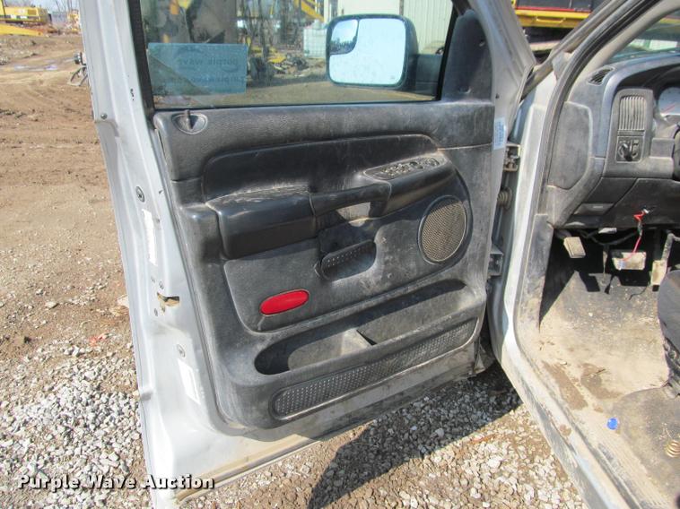 image for item J2597 2005 Dodge Ram 2500 Quad Cab flatbed pickup truck