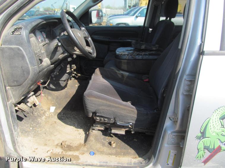 image for item J2597 2005 Dodge Ram 2500 Quad Cab flatbed pickup truck