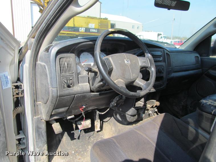 image for item J2597 2005 Dodge Ram 2500 Quad Cab flatbed pickup truck