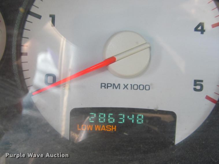 image for item J2597 2005 Dodge Ram 2500 Quad Cab flatbed pickup truck