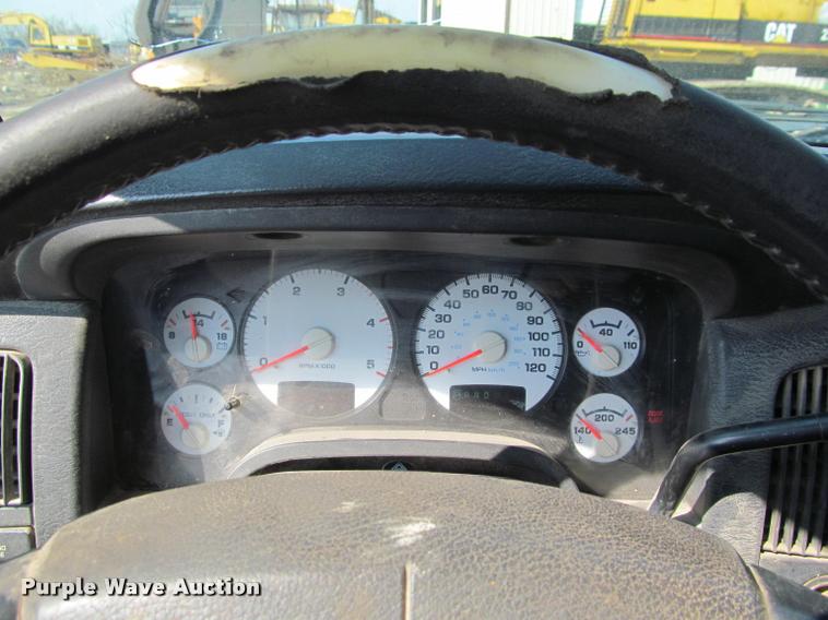 image for item J2597 2005 Dodge Ram 2500 Quad Cab flatbed pickup truck