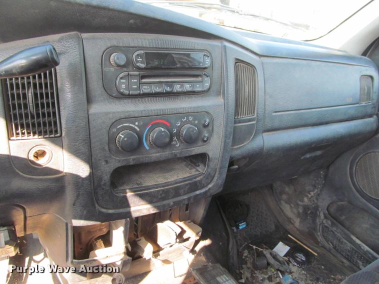 image for item J2597 2005 Dodge Ram 2500 Quad Cab flatbed pickup truck