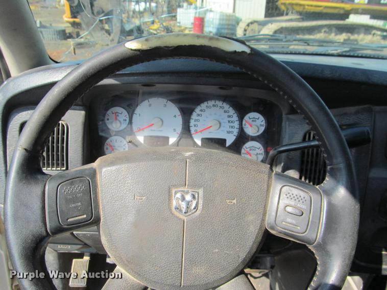 image for item J2597 2005 Dodge Ram 2500 Quad Cab flatbed pickup truck