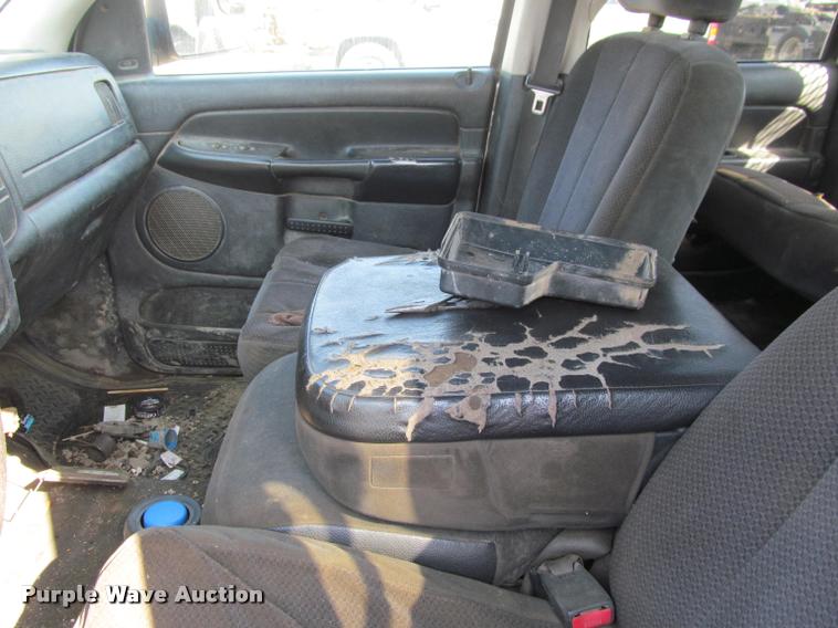 image for item J2597 2005 Dodge Ram 2500 Quad Cab flatbed pickup truck