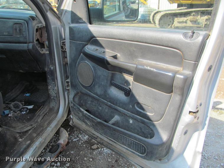 image for item J2597 2005 Dodge Ram 2500 Quad Cab flatbed pickup truck