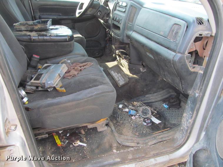 image for item J2597 2005 Dodge Ram 2500 Quad Cab flatbed pickup truck