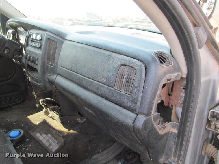 image for item J2597 2005 Dodge Ram 2500 Quad Cab flatbed pickup truck