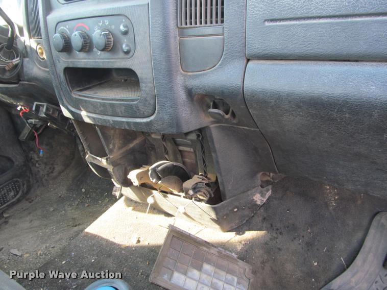 image for item J2597 2005 Dodge Ram 2500 Quad Cab flatbed pickup truck