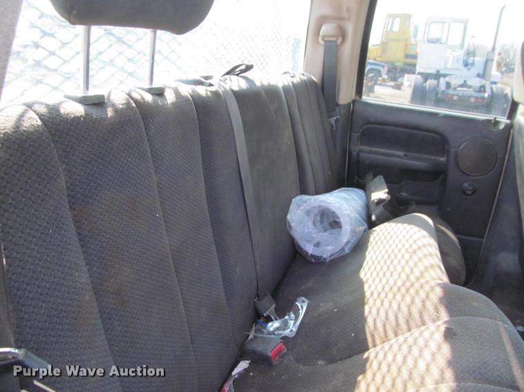 image for item J2597 2005 Dodge Ram 2500 Quad Cab flatbed pickup truck