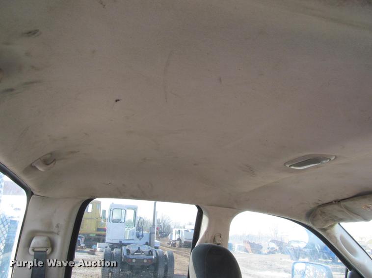 image for item J2597 2005 Dodge Ram 2500 Quad Cab flatbed pickup truck