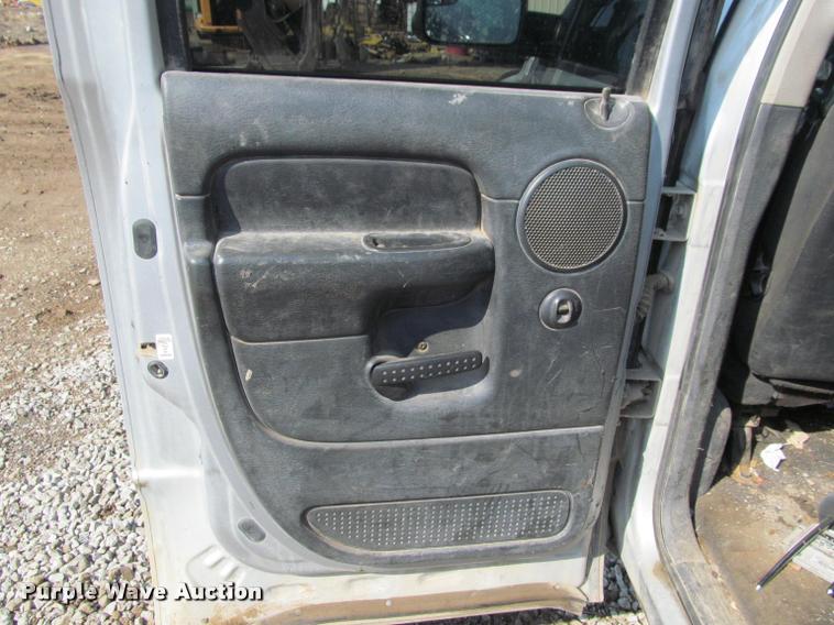 image for item J2597 2005 Dodge Ram 2500 Quad Cab flatbed pickup truck