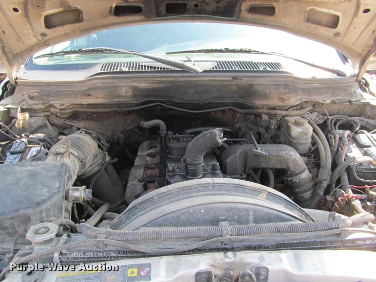 image for item J2597 2005 Dodge Ram 2500 Quad Cab flatbed pickup truck