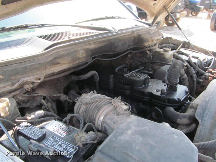 image for item J2597 2005 Dodge Ram 2500 Quad Cab flatbed pickup truck