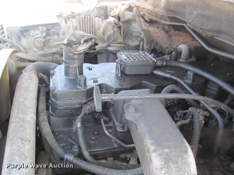 image for item J2597 2005 Dodge Ram 2500 Quad Cab flatbed pickup truck