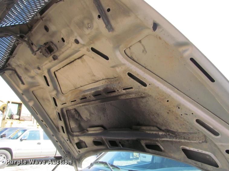 image for item J2597 2005 Dodge Ram 2500 Quad Cab flatbed pickup truck