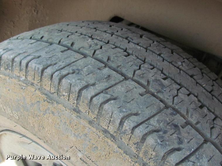 image for item J2597 2005 Dodge Ram 2500 Quad Cab flatbed pickup truck