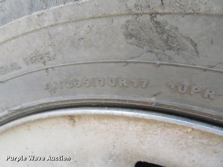 image for item J2597 2005 Dodge Ram 2500 Quad Cab flatbed pickup truck