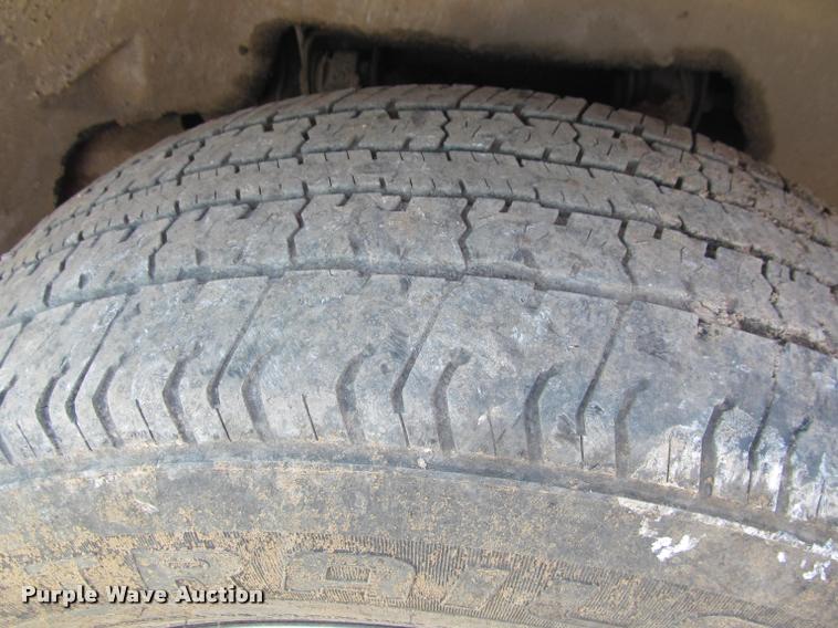 image for item J2597 2005 Dodge Ram 2500 Quad Cab flatbed pickup truck