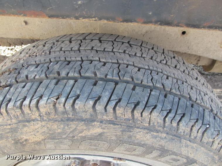 image for item J2597 2005 Dodge Ram 2500 Quad Cab flatbed pickup truck