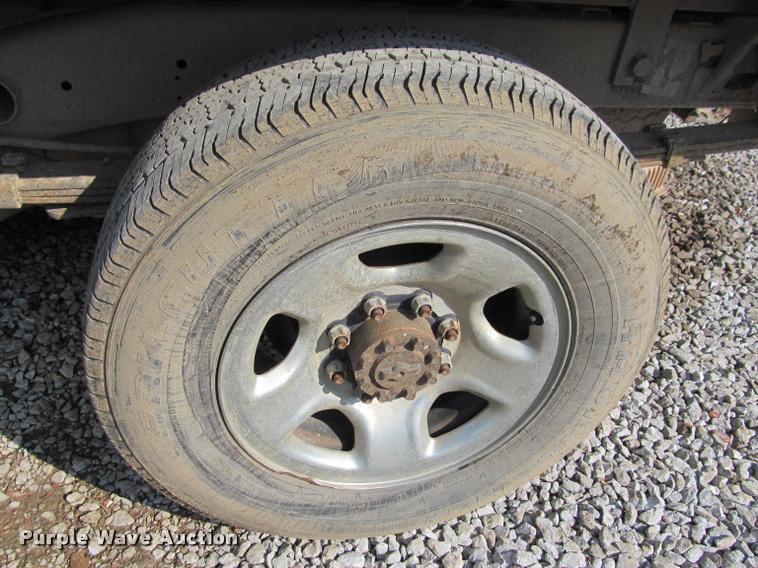 image for item J2597 2005 Dodge Ram 2500 Quad Cab flatbed pickup truck